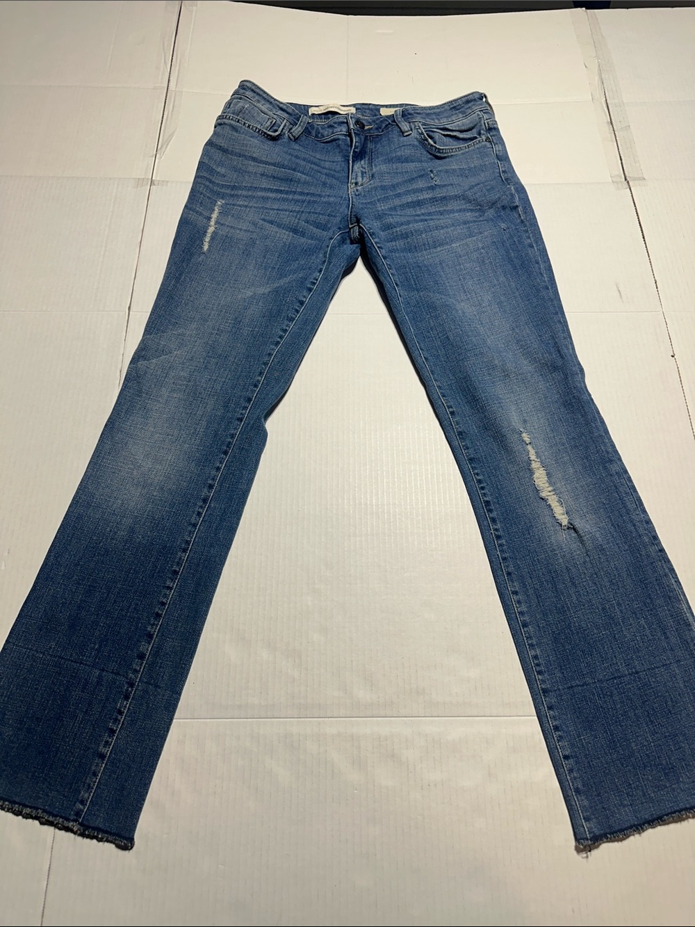Pilcro Anthro Hyphen Classic Mid-Blue Distressed Flare Jeans with fraying zip up